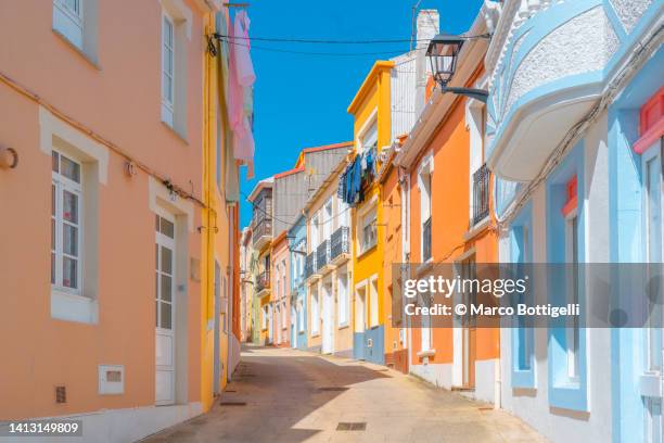 colorful houses along tiny alley. galicia, spain - a coruna stock-fotos und bilder