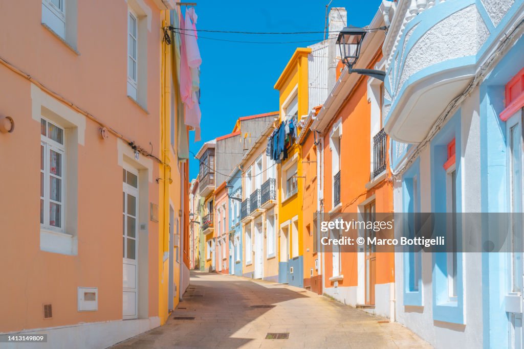 Colorful houses along tiny alley. Galicia, Spain