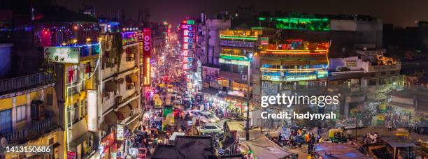 city life - main bazar in delhi by night, india - new delhi stock pictures, royalty-free photos & images