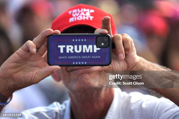 Guests attend a rally with former President Donald Trump on August 05, 2022 in Waukesha, Wisconsin. Trump is expected to announce his endorsement of...