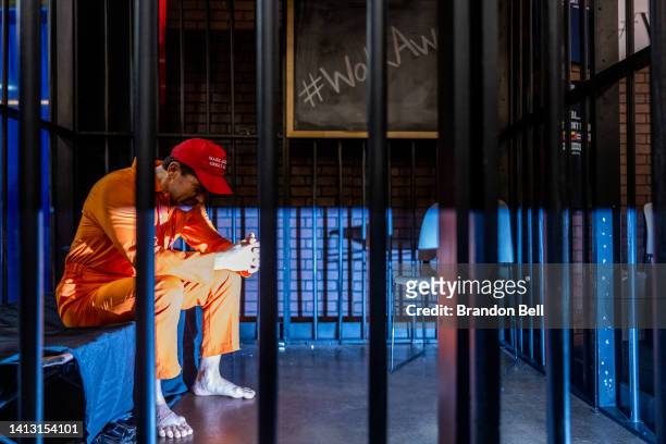 Pro-Trump influencer Brandon Straka sits in a simulated jail cell during a demonstration at the Conservative Political Action Conference CPAC held at...