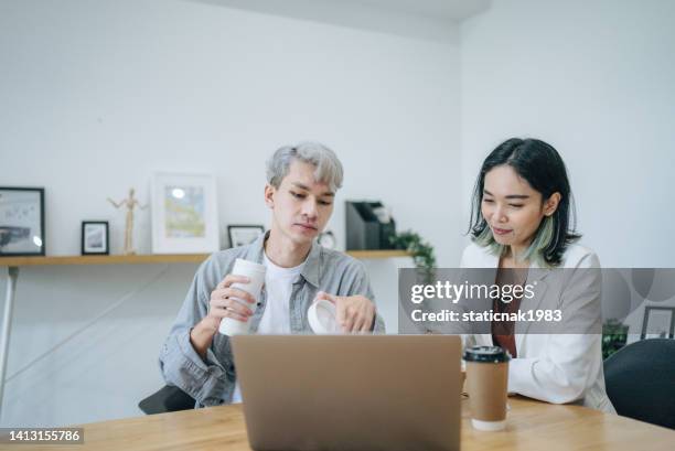 business people eating breakfast and meeting at table in open plan office - business lunch stock pictures, royalty-free photos & images