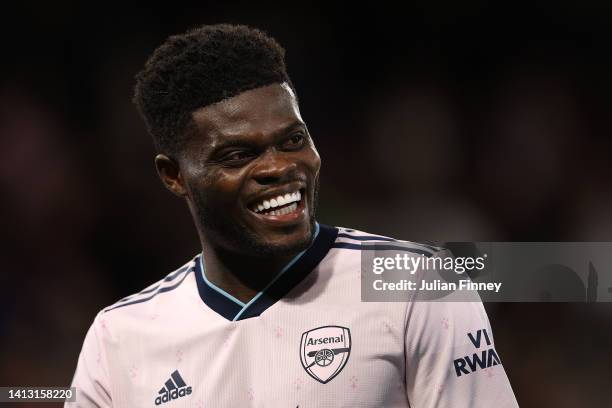 Thomas Partey of Arsenal smiles following the Premier League match between Crystal Palace and Arsenal FC at Selhurst Park on August 05, 2022 in...