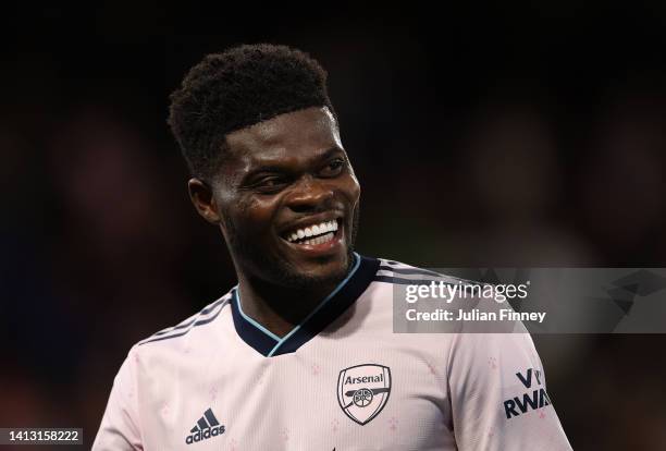 Thomas Partey of Arsenal smiles following the Premier League match between Crystal Palace and Arsenal FC at Selhurst Park on August 05, 2022 in...