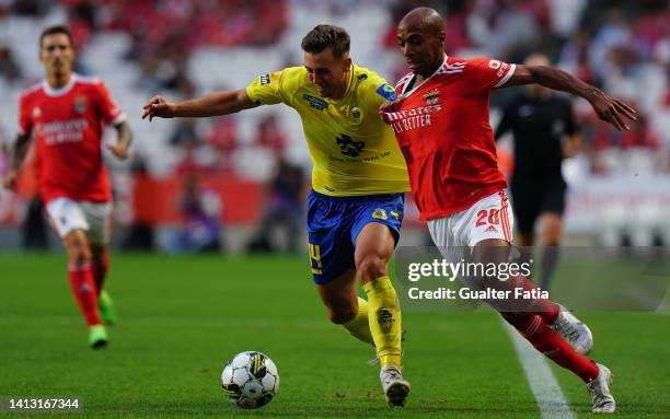Joao Mario of SL Benfica with Oriol Busquets of FC Arouca in action during the Liga Portugal Bwin match between SL Benfica and FC Arouca at Estadio...