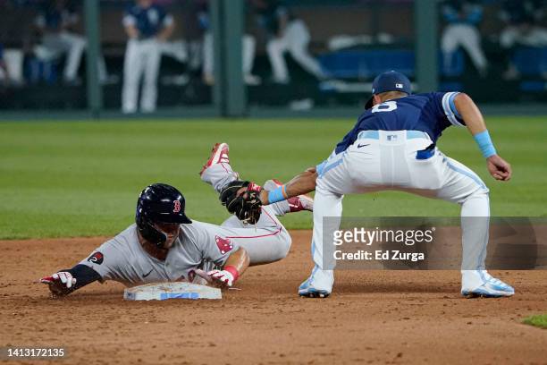 Yolmer Sanchez of the Boston Red Sox slides into second past Nicky Lopez of the Kansas City Royals for a steal in the fifth inning at Kauffman...