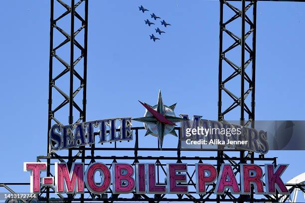 The Blue Angels do a flyover before the game between the Seattle Mariners and the Los Angeles Angels at T-Mobile Park on August 05, 2022 in Seattle,...