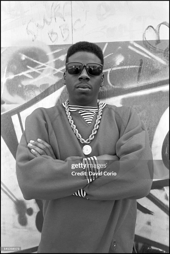 Scooly Rapper American rapper Schoolly D poses in front of a graffiti tagged wall ...