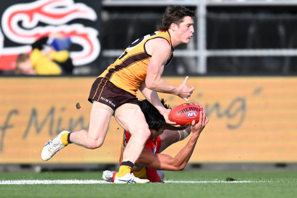 Josh Ward of the Hawks competes for the ball during the round 21 AFL match between the Hawthorn Hawks and the Gold Coast Suns at University of...