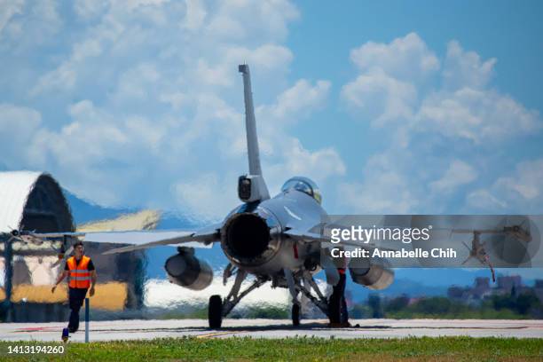An Air Force personnel conducts the aircraft inspection to a Taiwanese F-16 Fighting Falcon upon landing at Hualien Air Force Base on August 06, 2022...