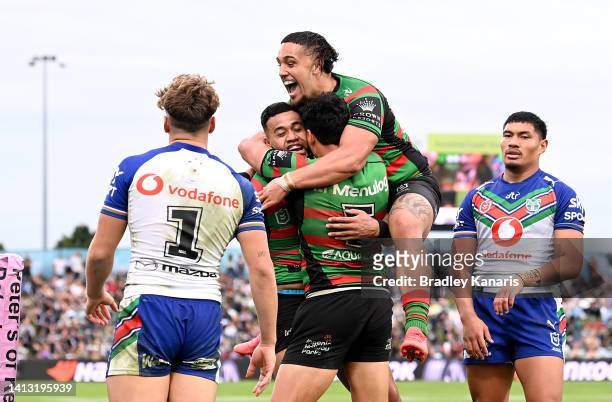 Isaac Thompson of the Rabbitohs celebrates scoring a try during the round 21 NRL match between the South Sydney Rabbitohs and the New Zealand...