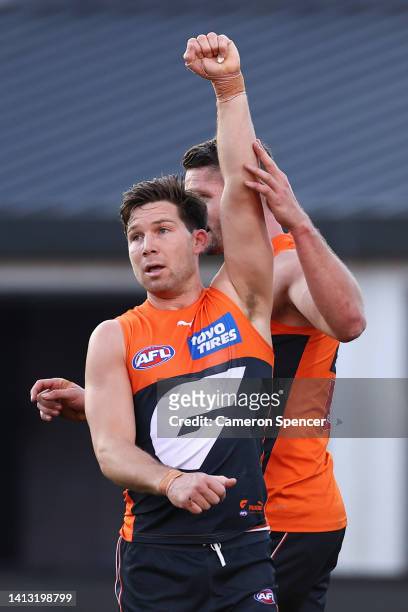 Toby Greene of the Giants celebrates a goal with Jesse Hogan of the Giants during the round 21 AFL match between the Greater Western Sydney Giants...