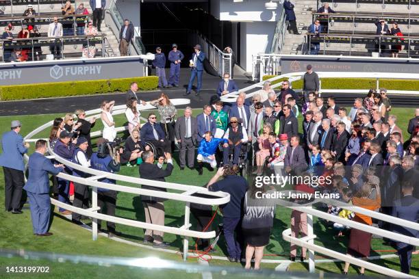Past and present jockeys pose for a photo at the Nsw Jockeys Reunion during Sydney Racing at Royal Randwick Racecourse on August 06, 2022 in Sydney,...