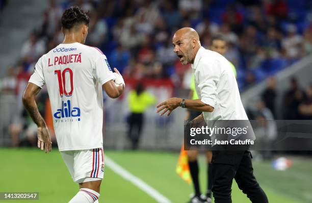 Coach of Olympique Lyonnais Peter Bosz talks to Lucas Paqueta of Lyon during the Ligue 1 match between Olympique Lyonnais and AC Ajaccio at Groupama...
