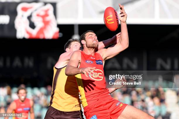 Ben McEvoy of the Hawks and Jarrod Witts of the Suns compete for the ball during the round 21 AFL match between the Hawthorn Hawks and the Gold Coast...