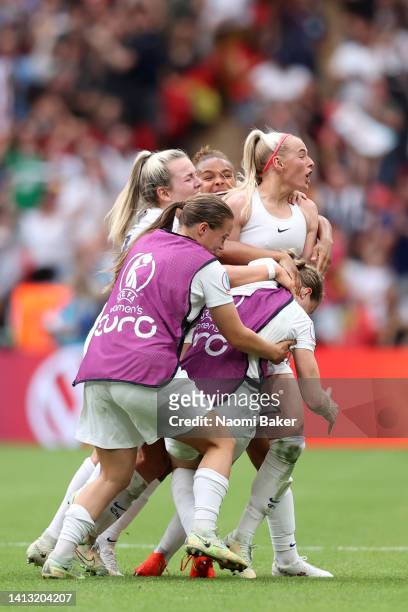 Chloe Kelly of England celebrates with her team after scoring her sides second goal during the UEFA Women's Euro 2022 final match between England and...