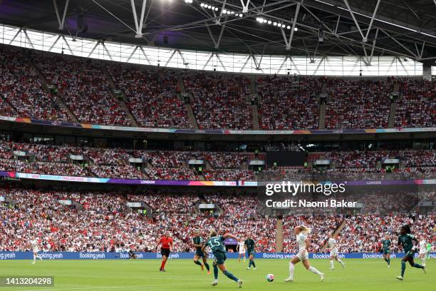 General view as Chloe Kelly of England runs with the ball during the UEFA Women's Euro 2022 final match between England and Germany at Wembley...