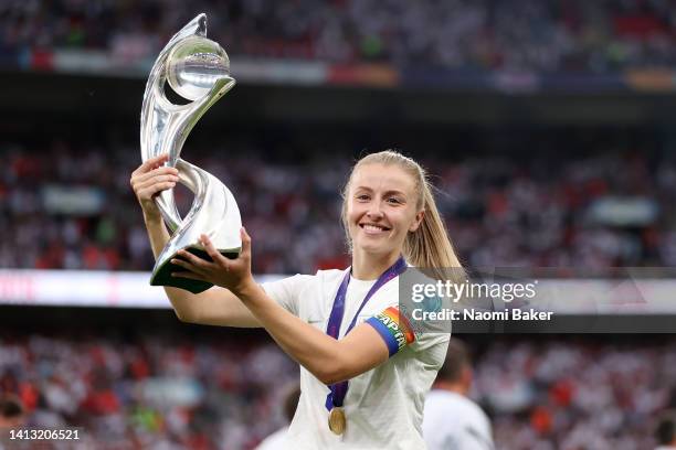 Leah Williamson of England celebrates with the trophy following her teams victory during the UEFA Women's Euro 2022 final match between England and...