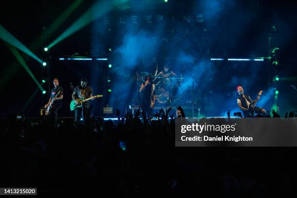 Musicians Justin Hills, Tony Pizzuti, Kellin Quinn, Matty Best, and Nick Martin of Sleeping With Sirens perform on stage at The Observatory North...