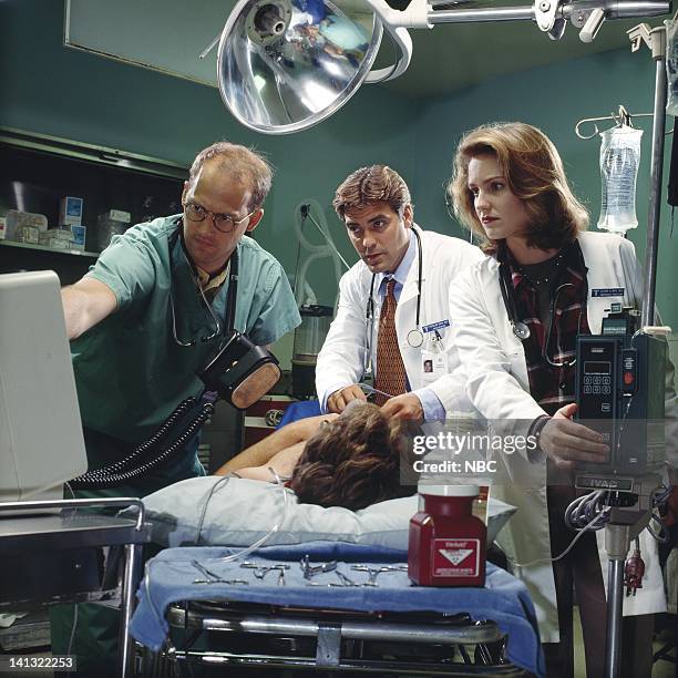 Season 1 -- Pictured: Anthony Edwards as Doctor Mark Greene, George Clooney as Doctor Doug Ross, Sherry Stringfield as Doctor Susan Lewis -- Photo...