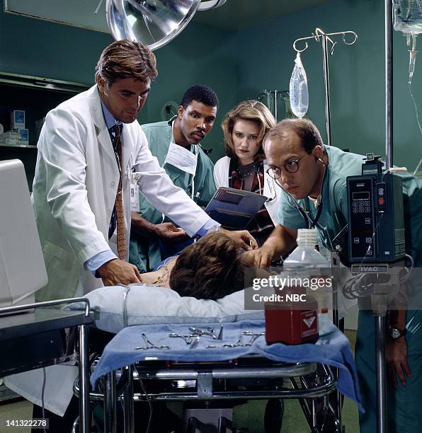 Season 1 -- Pictured: George Clooney as Doctor Doug Ross, Eriq La Salle as Doctor Peter Benton, Sherry Stringfield as Doctor Susan Lewis, Anthony...