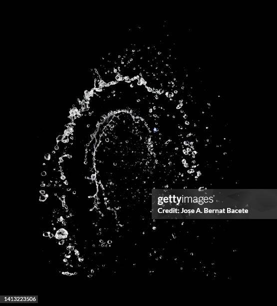 jets and splashes of water moving up on a black background. - acqua splash foto e immagini stock