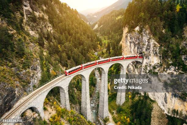 train crossing landwasser viaduct , switzerland - engadin stock pictures, royalty-free photos & images