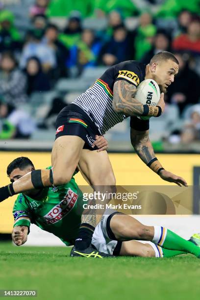 James Fisher-Harris of the Panthers is tackled during the round 21 NRL match between the Canberra Raiders and the Penrith Panthers at GIO Stadium, on...
