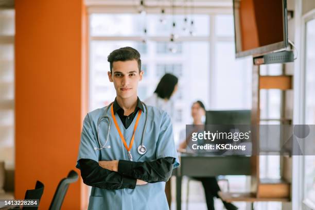 male nurse photo in a hospital - vaccine confidence stock pictures, royalty-free photos & images