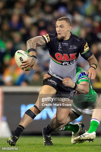 James Fisher-Harris of the Panthers is tackled during the round 21 NRL match between the Canberra Raiders and the Penrith Panthers at GIO Stadium, on...