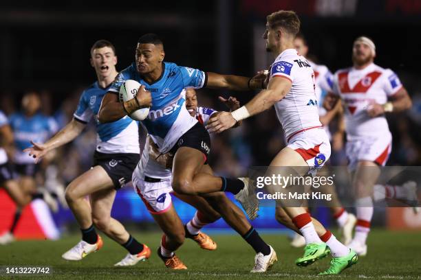 Ronaldo Mulitalo of the Sharks makes a break during the round 21 NRL match between the Cronulla Sharks and the St George Illawarra Dragons at...