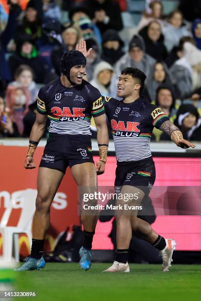 Stephen Crichton of the Panthers celebrates a try during the round 21 NRL match between the Canberra Raiders and the Penrith Panthers at GIO Stadium,...