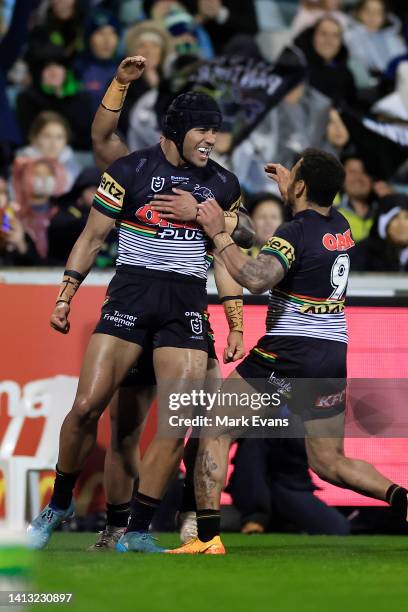 Stephen Crichton of the Panthers celebrates a try during the round 21 NRL match between the Canberra Raiders and the Penrith Panthers at GIO Stadium,...