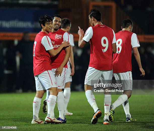 Ju Young Park celebrates scoring for Arsenal with Andre Santos and Maroaune Chamakh during the Barclays Premier Reserve League match between Arsenal...