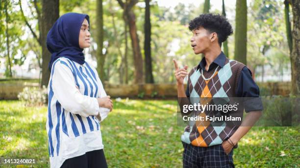 asian young couple at park - malay couple stock pictures, royalty-free photos & images