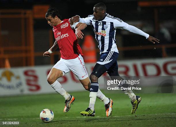 Marouane Chamakh of Arsenal holds off Donervorn Daniels of WBA during the Barclays Premier Reserve League match between Arsenal Reserves and West...