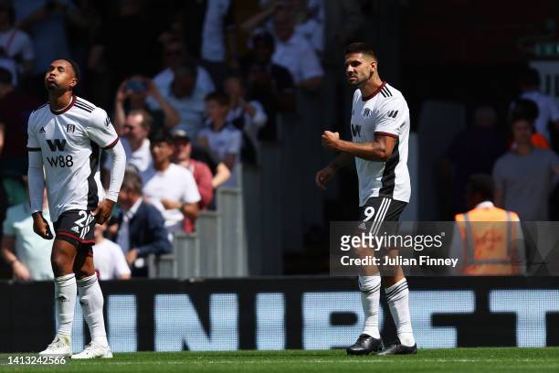 Aleksandar Mitrovic of Fulham celebrates scoring their side's first goal with teammates during the Premier League match between Fulham FC and...