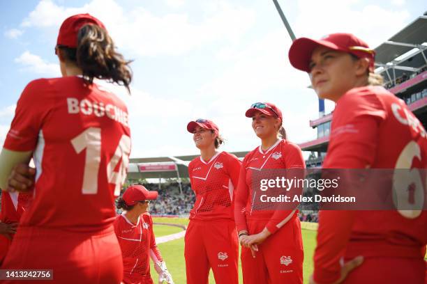 Nat Sciver and Sarah Glenn of Team England stand in a huddle with teammates prior to the Cricket T20 - Semi-Final match between Team England and Team...