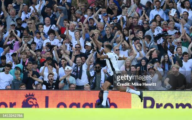 Aleksandar Mitrovic of Fulham celebrates scoring their side's first goal during the Premier League match between Fulham FC and Liverpool FC at Craven...