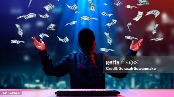 faceless hackers and malware hackers use laptops with dangerous digital code on binary code background. - stealing idea stock pictures, royalty-free photos & images