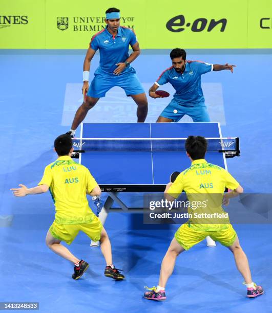 Sharath Kamal Achanta and Sathiyan Gnanasekaran of Team India compete against Nicholas Lum and Finn Luu of Team Australia during the Men's Doubles -...