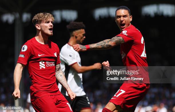 Darwin Nunez of Liverpool celebrates scoring their side's first goal with teammates Harvey Elliott during the Premier League match between Fulham FC...