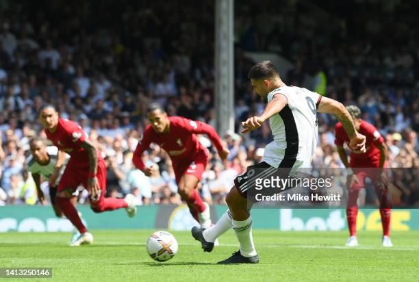 Aleksandar Mitrovic of Fulham scores their side's second goal from a penalty during the Premier League match between Fulham FC and Liverpool FC at...