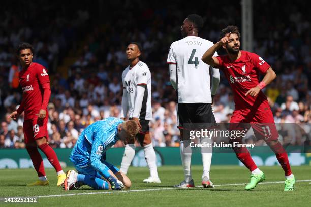 Marek Rodak of Fulham reacts as Mohamed Salah of Liverpool celebrates scoring their side's second goal during the Premier League match between Fulham...