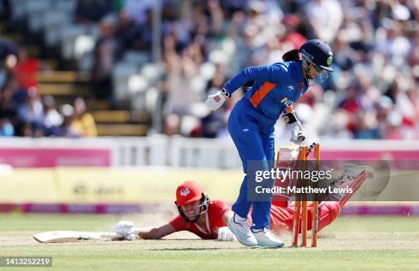 Taniyaa Bhatia of Team India runs out Nat Sciver of Team England during the Cricket T20 - Semi-Final match between Team England and Team India on day...