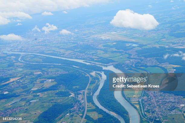flowing rhine river, borders france and germany, saint louis, france - haut rhin stock-fotos und bilder