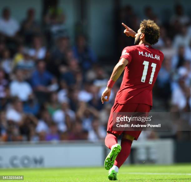 Mohamed Salah of Liverpool celebrates after scoring the second goal during the Premier League match between Fulham FC and Liverpool FC at Craven...