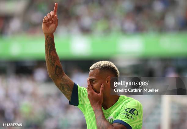 Lukas Nmecha of VfL Wolfsburg celebrates scoring their side's first goal during the Bundesliga match between VfL Wolfsburg and SV Werder Bremen at...