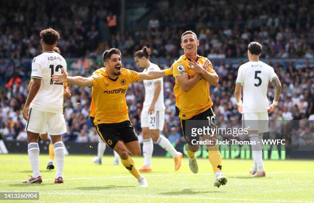 Daniel Podence of Wolverhampton Wanderers celebrates their side's first goal with teammate Pedro Neto during the Premier League match between Leeds...