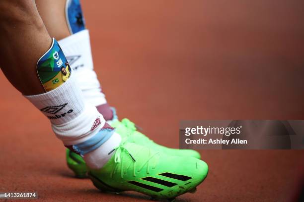 Vitinho of Burnley FC adjusts his shin pads during the Sky Bet Championship match between Burnley and Luton Town at Turf Moor on August 06, 2022 in...
